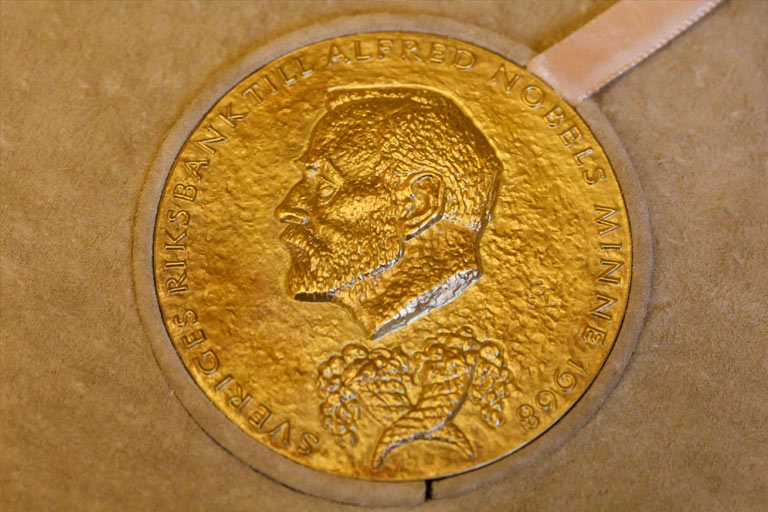 A glittering close-up of Elinor Ostrom's Nobel Prize, on display in Indiana University Bloomington's Bryan Hall.